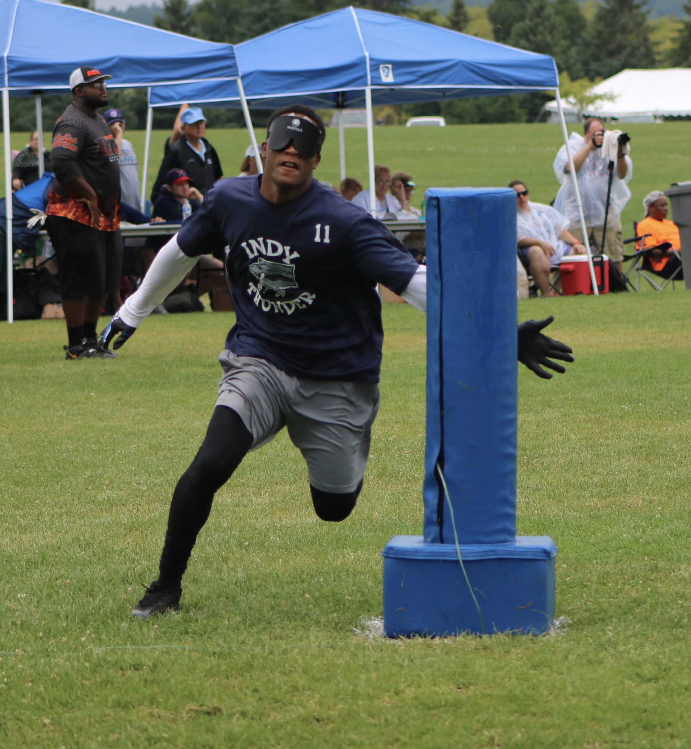 Corion White runs through the base with his arm outstretched